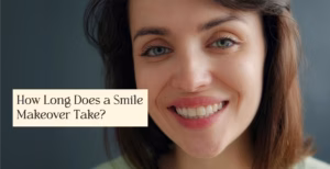 Close-up portrait of a smiling woman with green eyes, brown hair, and a light green shirt against a dark background.
