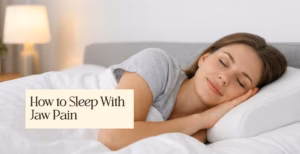 Woman sleeping peacefully on her side with text overlay 'How to Sleep With Jaw Pain'.