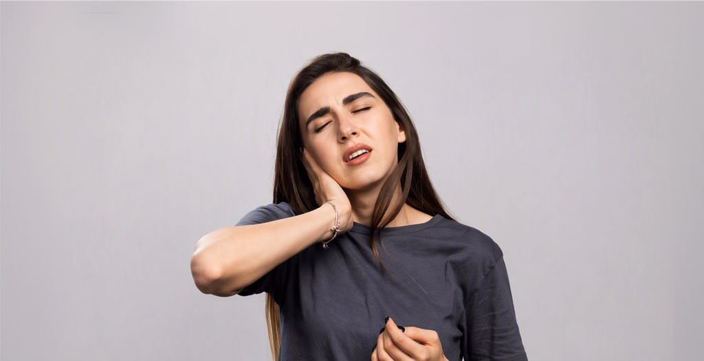Person holding the side of the neck in discomfort, illustrating jaw-related pain, muscle tension, TMJ disorders, and oral health concerns.