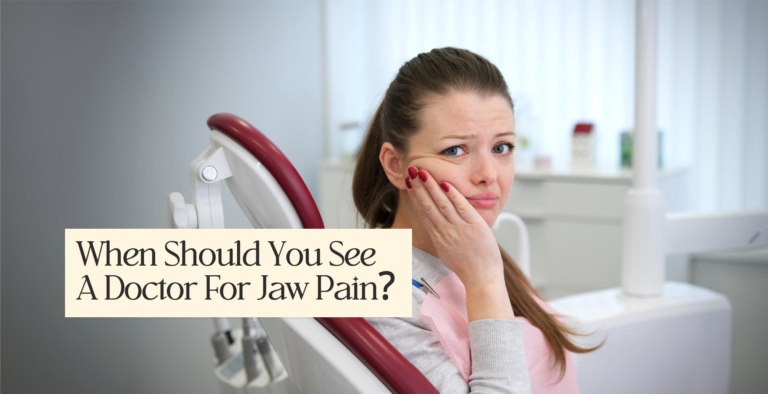 Woman in a dental chair holding her painful jaw. Text asks: When Should You See A Doctor For Jaw Pain?